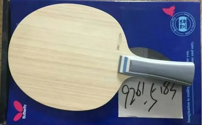 Two table tennis paddles side by side showing Fan Zhendong ALC and Viscaria handles and black rubbers