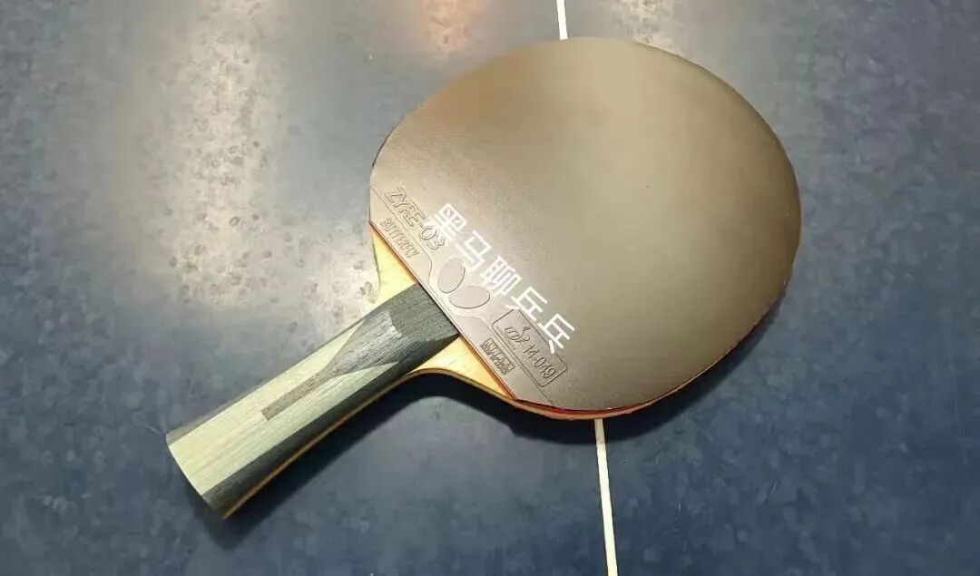 Author practicing forehand serves at the table tennis club to explore new techniques