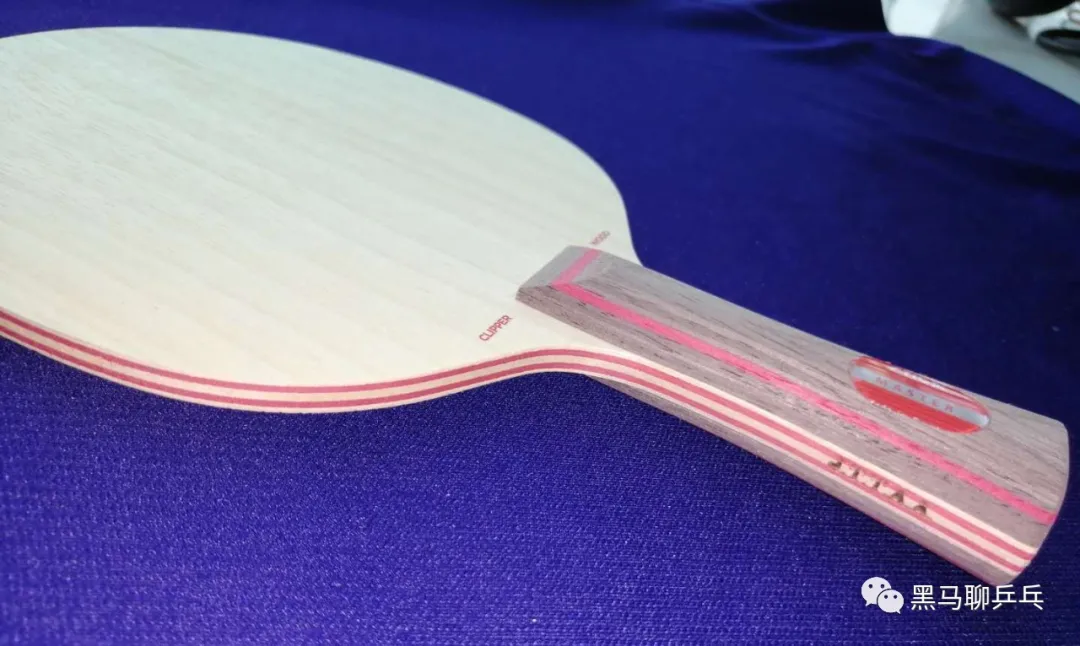 Stiga Clipper all-wood blade on a blue table