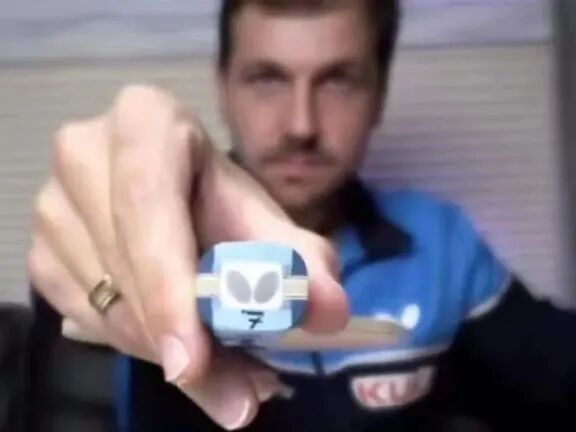 Timo Boll in action during a competitive match showing his close-table forehand loop