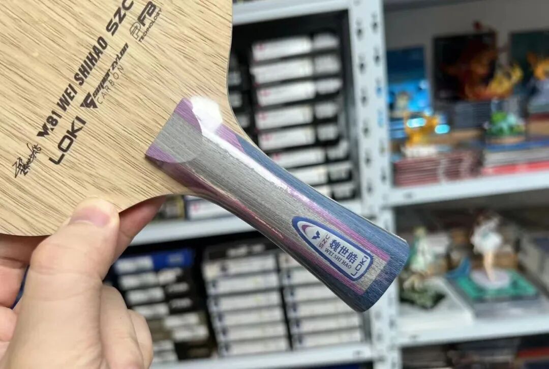Loki Wei Shihao SZC inner super ZLC blade showing purple handle close-up