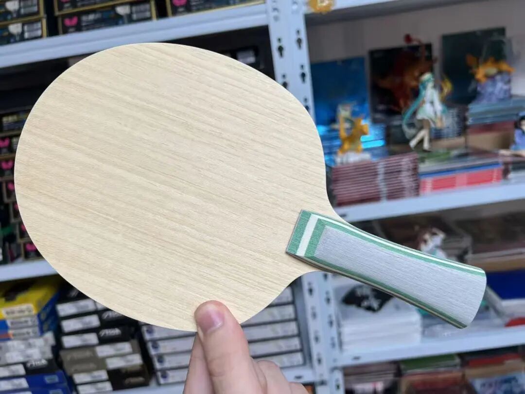 Stiga Luma Mixed Carbon pro-stock blade with koto face and blue-green spliced design